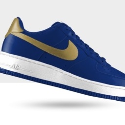 royal blue nike casual shoes with white soles and a gold swoosh