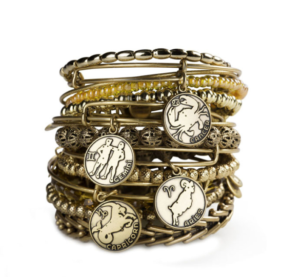 stack of alex and ani bracelets with zodiac charms