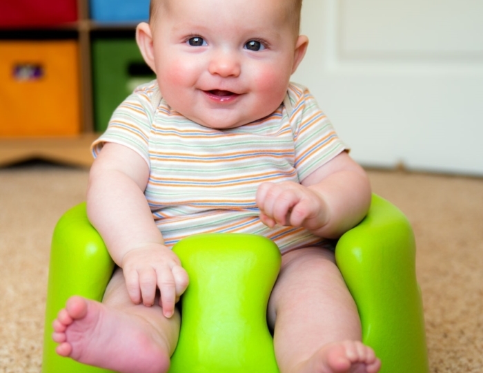 Baby sitting on baby chair