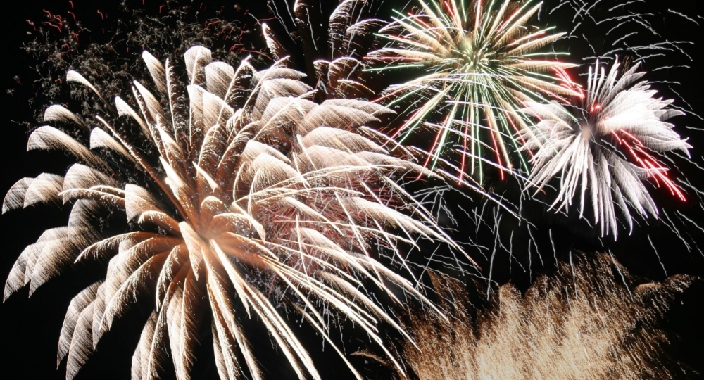 a montage of fireworks at a canada day celebration