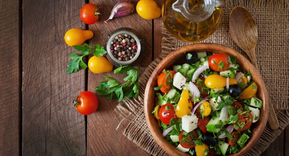 greek salad with fresh vegetables, feta cheese and black olives