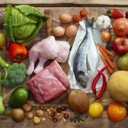 various paleo diet products on wooden table, top view