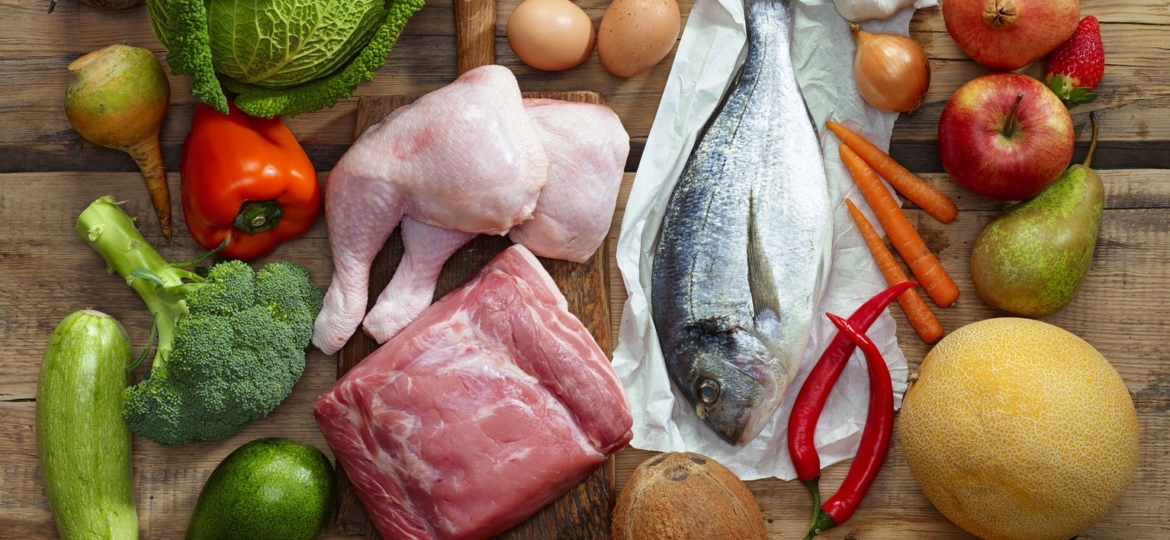 various paleo diet products on wooden table, top view