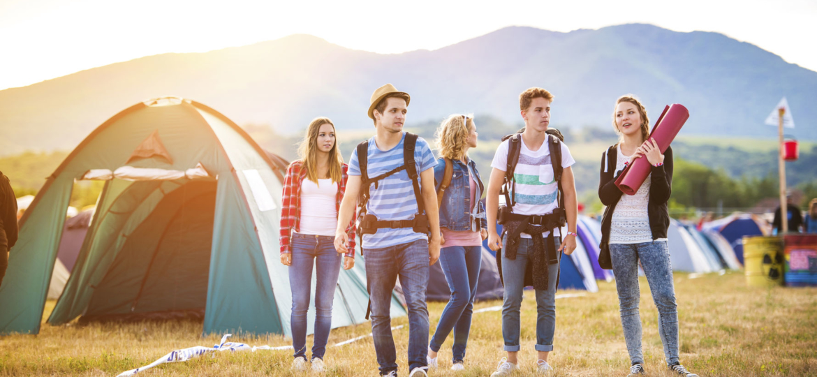 45742535 - group of beautiful teens arriving at summer festival