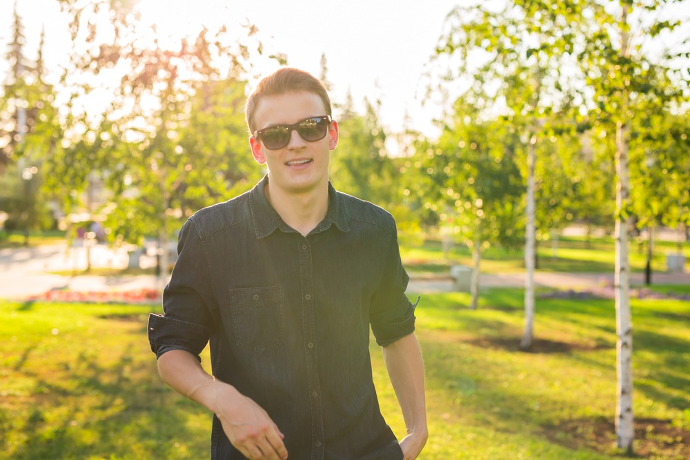 man outside wearing nice pair of sunglasses.