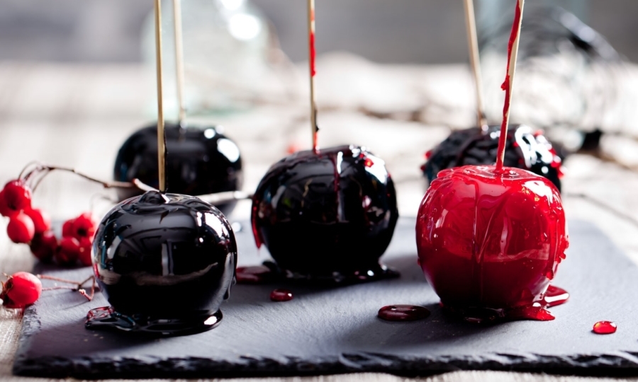 Poison Candy Apples sitting on a baking mat